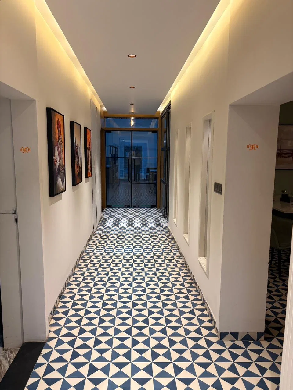 best-veg-restaurant-nh52-laxmangarh, Esthetic lobby with Images hanging and floor tiles