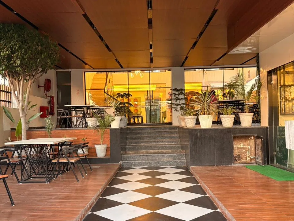 best-veg-restaurant-nh52-laxmangarh, Entance lobby with plants and esthetic floor
